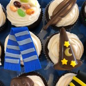 Bertie Botts Every Flavor Beans, a quill, a Ravenclaw scarf and a wizard's hat