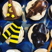 wizard's hat, Scabbers the rat, Hufflepuff scarf and a chocolate frog